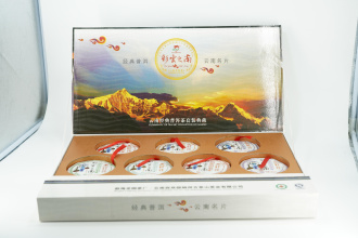 Pressed Rip Pu-erh Tea - Collectible set of 2011 shu pu-erh "South of colored clouds" from the "Dragon Garden" factory, 7 cakes of 100 g each., 